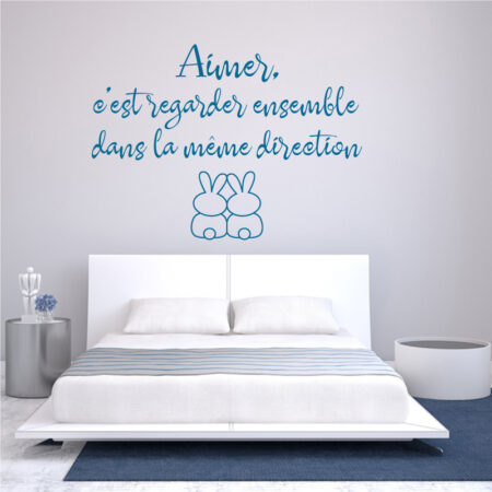 Sticker citation manuscrite avec phrase sur l'amour et deux lapins assis côte à côte vus de dos