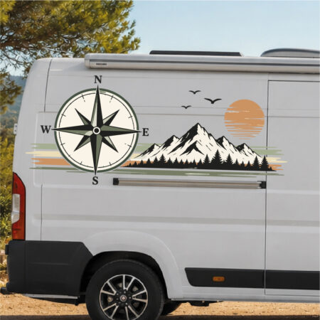 Sticker représentant une chaîne de montagnes, une boussole et un coucher de soleil avec des oiseaux en vol